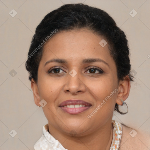 Joyful latino adult female with short  brown hair and brown eyes