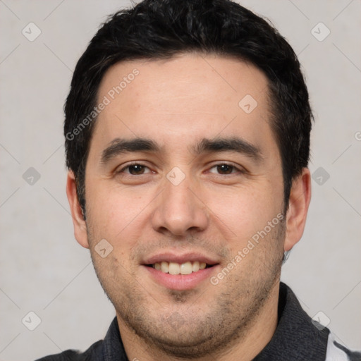 Joyful white young-adult male with short  black hair and brown eyes