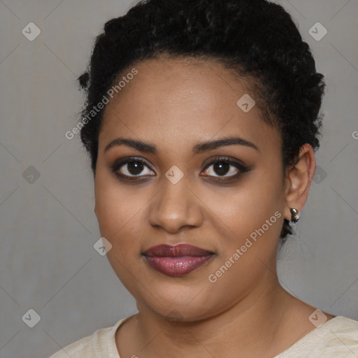 Joyful black young-adult female with short  black hair and brown eyes