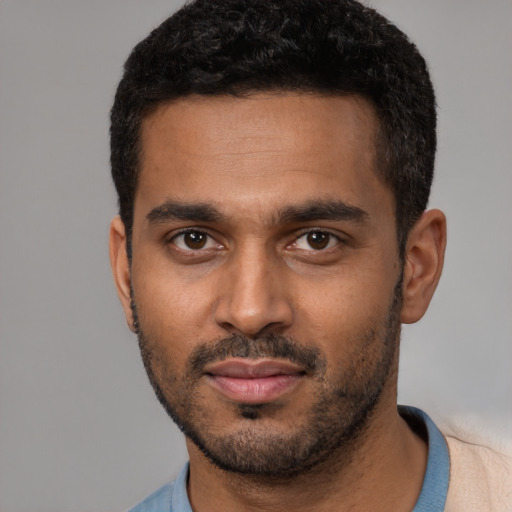 Neutral black young-adult male with short  black hair and brown eyes