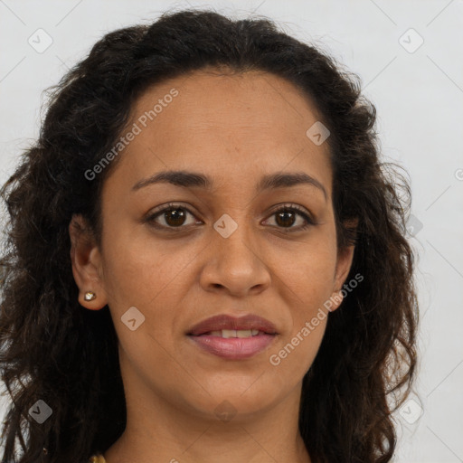 Joyful latino adult female with long  brown hair and brown eyes