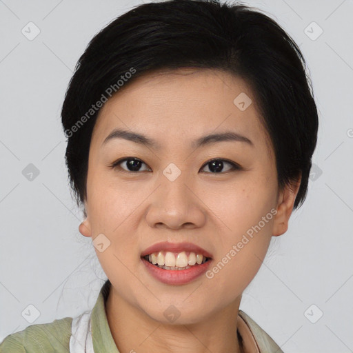 Joyful asian young-adult female with medium  black hair and brown eyes