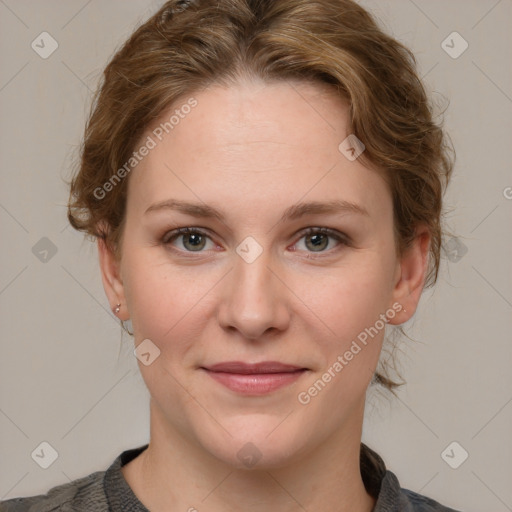 Joyful white young-adult female with medium  brown hair and blue eyes