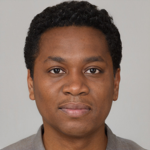 Neutral black young-adult male with short  brown hair and brown eyes