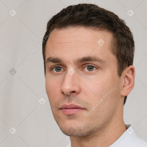 Neutral white young-adult male with short  brown hair and brown eyes