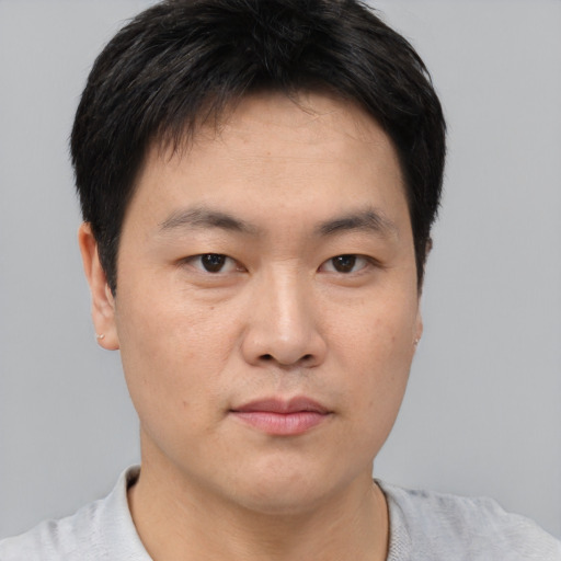 Neutral asian young-adult male with short  black hair and brown eyes