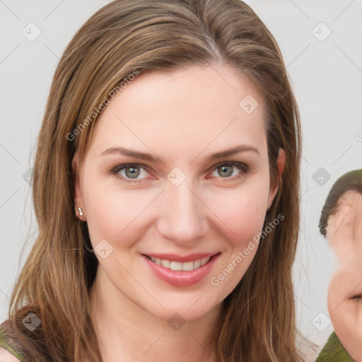 Joyful white young-adult female with medium  brown hair and green eyes