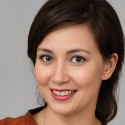 Joyful white young-adult female with medium  brown hair and brown eyes