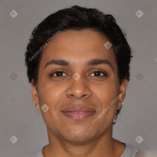 Joyful latino young-adult male with short  brown hair and brown eyes