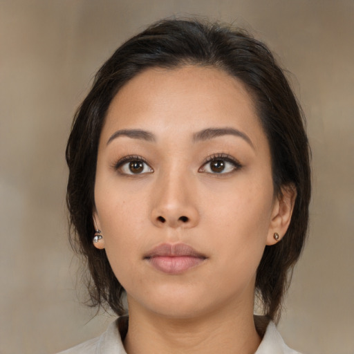 Neutral asian young-adult female with medium  brown hair and brown eyes
