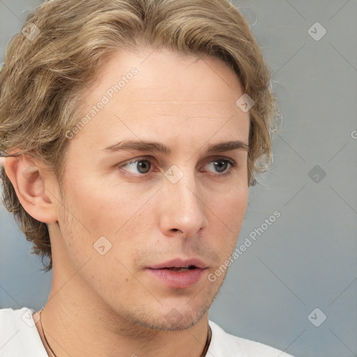 Neutral white young-adult male with short  brown hair and grey eyes