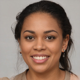 Joyful latino young-adult female with medium  brown hair and brown eyes