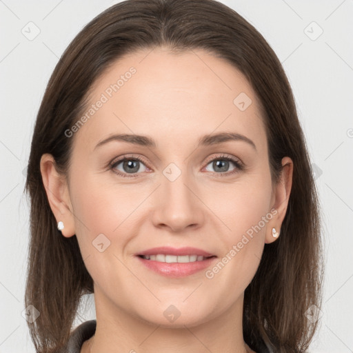 Joyful white young-adult female with long  brown hair and grey eyes