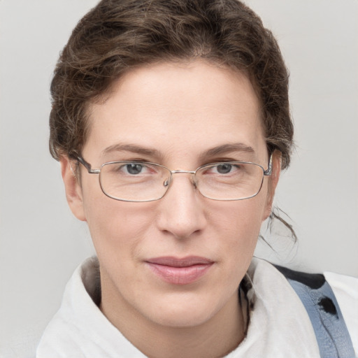 Joyful white adult female with short  brown hair and grey eyes