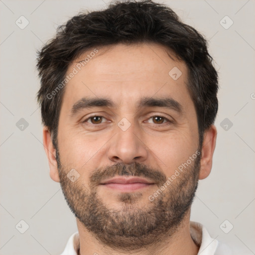 Joyful white adult male with short  brown hair and brown eyes