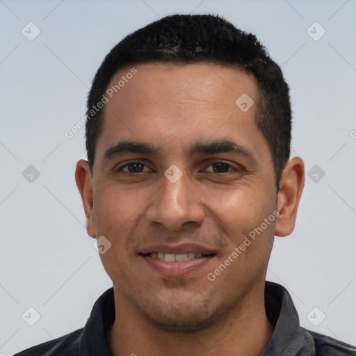Joyful white young-adult male with short  black hair and brown eyes