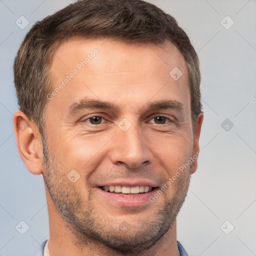 Joyful white adult male with short  brown hair and brown eyes