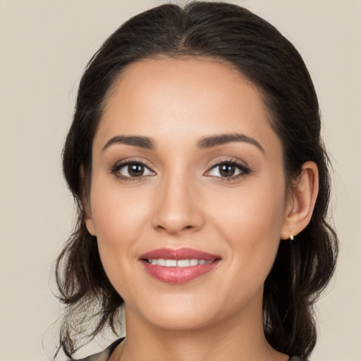 Joyful white young-adult female with medium  brown hair and brown eyes