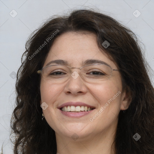 Joyful white adult female with long  brown hair and brown eyes