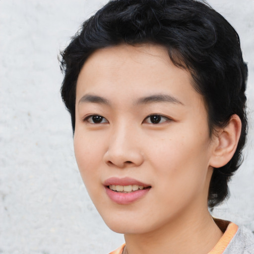 Joyful asian young-adult female with short  black hair and brown eyes