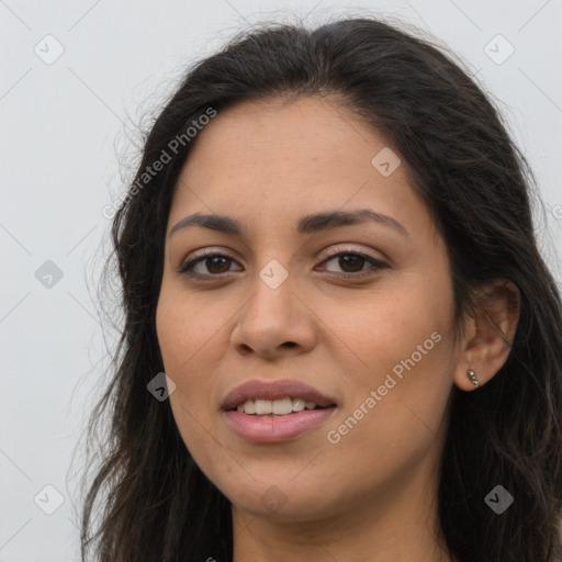 Joyful latino young-adult female with long  brown hair and brown eyes