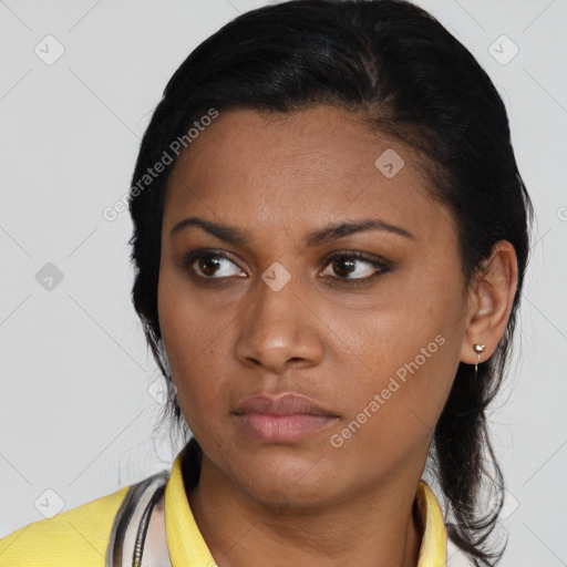 Neutral black young-adult female with medium  brown hair and brown eyes