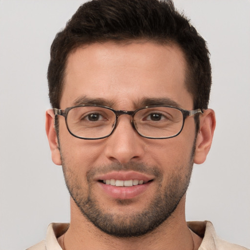 Joyful white young-adult male with short  brown hair and brown eyes