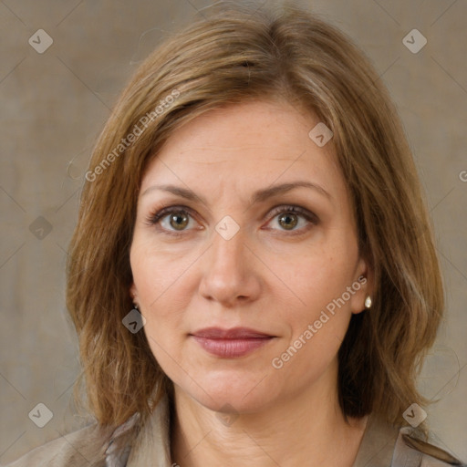 Joyful white adult female with medium  brown hair and brown eyes