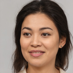 Joyful asian young-adult female with medium  brown hair and brown eyes