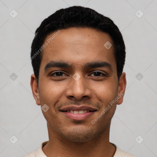 Joyful latino young-adult male with short  black hair and brown eyes