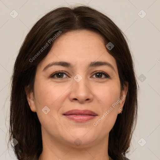 Joyful white adult female with medium  brown hair and brown eyes