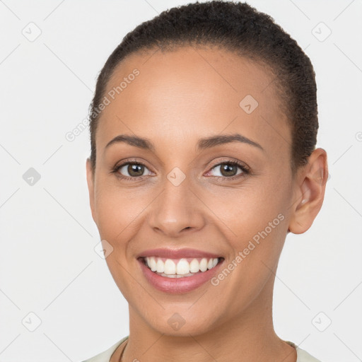 Joyful white young-adult female with short  brown hair and brown eyes