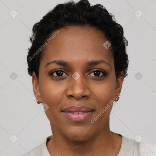 Joyful black young-adult female with short  black hair and brown eyes