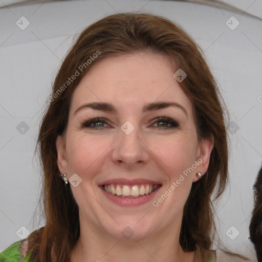 Joyful white young-adult female with medium  brown hair and green eyes