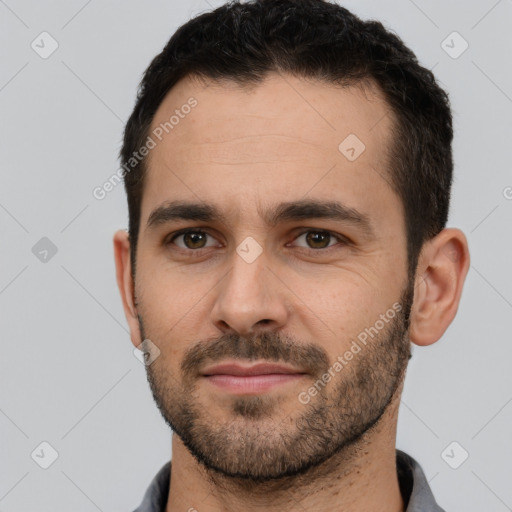 Joyful white young-adult male with short  brown hair and brown eyes