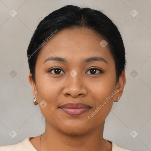 Joyful latino young-adult female with short  black hair and brown eyes