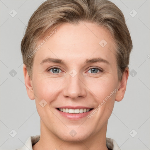 Joyful white young-adult female with short  brown hair and grey eyes