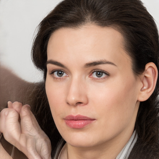 Neutral white young-adult female with medium  brown hair and brown eyes