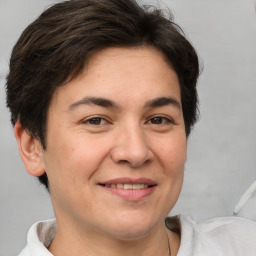 Joyful white adult female with short  brown hair and brown eyes