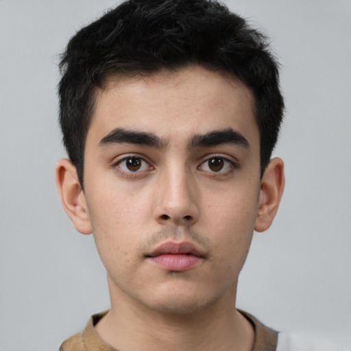 Neutral white young-adult male with short  black hair and brown eyes