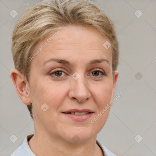 Joyful white adult female with short  brown hair and blue eyes