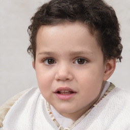 Joyful white child male with short  brown hair and brown eyes