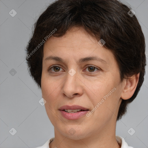 Joyful white adult female with short  brown hair and brown eyes