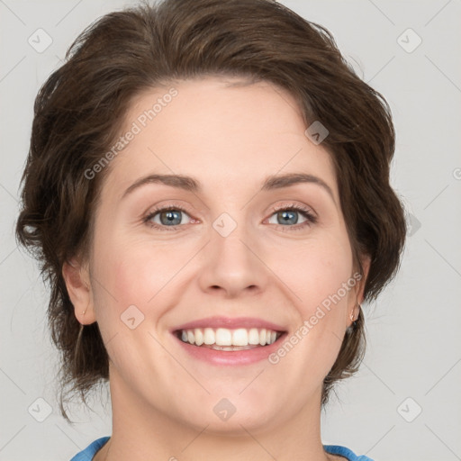 Joyful white young-adult female with medium  brown hair and green eyes