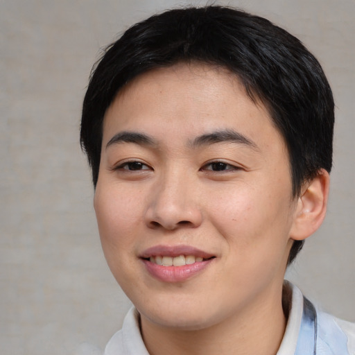 Joyful asian young-adult female with short  black hair and brown eyes
