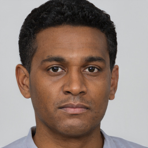 Neutral black young-adult male with short  brown hair and brown eyes