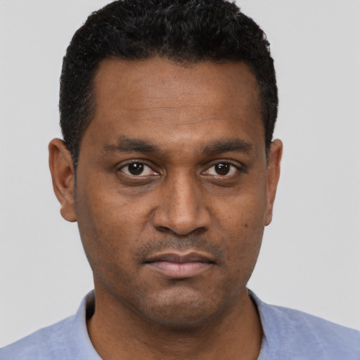 Neutral black young-adult male with short  black hair and brown eyes
