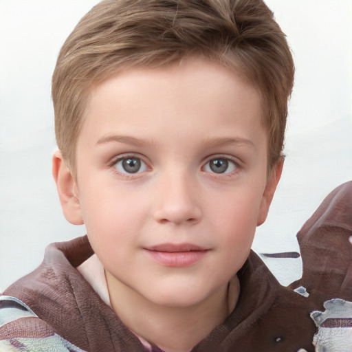 Joyful white child male with short  brown hair and blue eyes