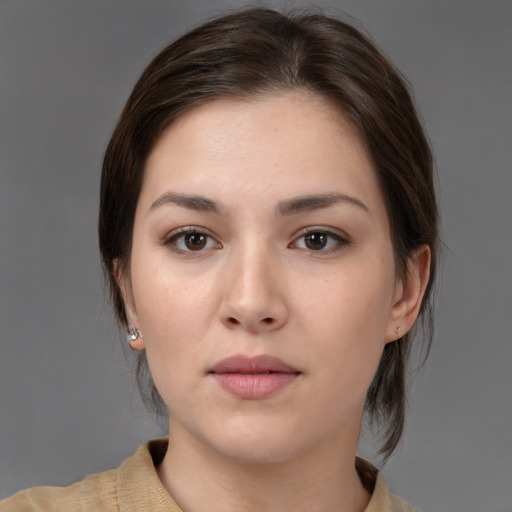 Neutral white young-adult female with medium  brown hair and brown eyes