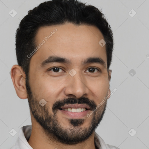 Joyful latino young-adult male with short  black hair and brown eyes